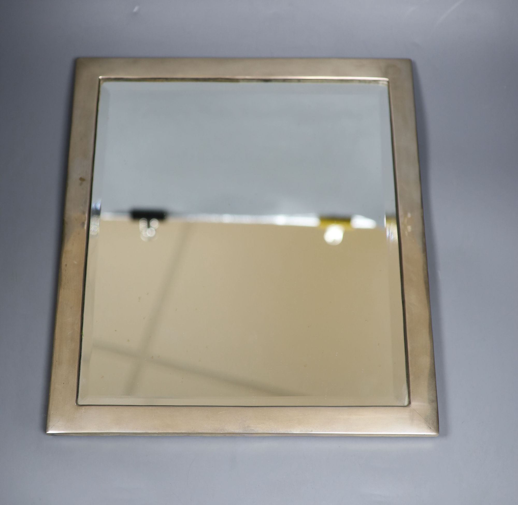 A sterling mounted wooden backed rectangular easel mirror, 39.7cm.